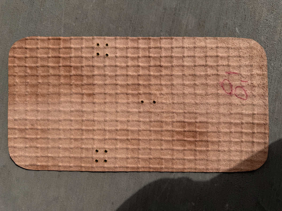 Inside of A6 Pocket Woven Espresso journal showing red writing and gold grommets