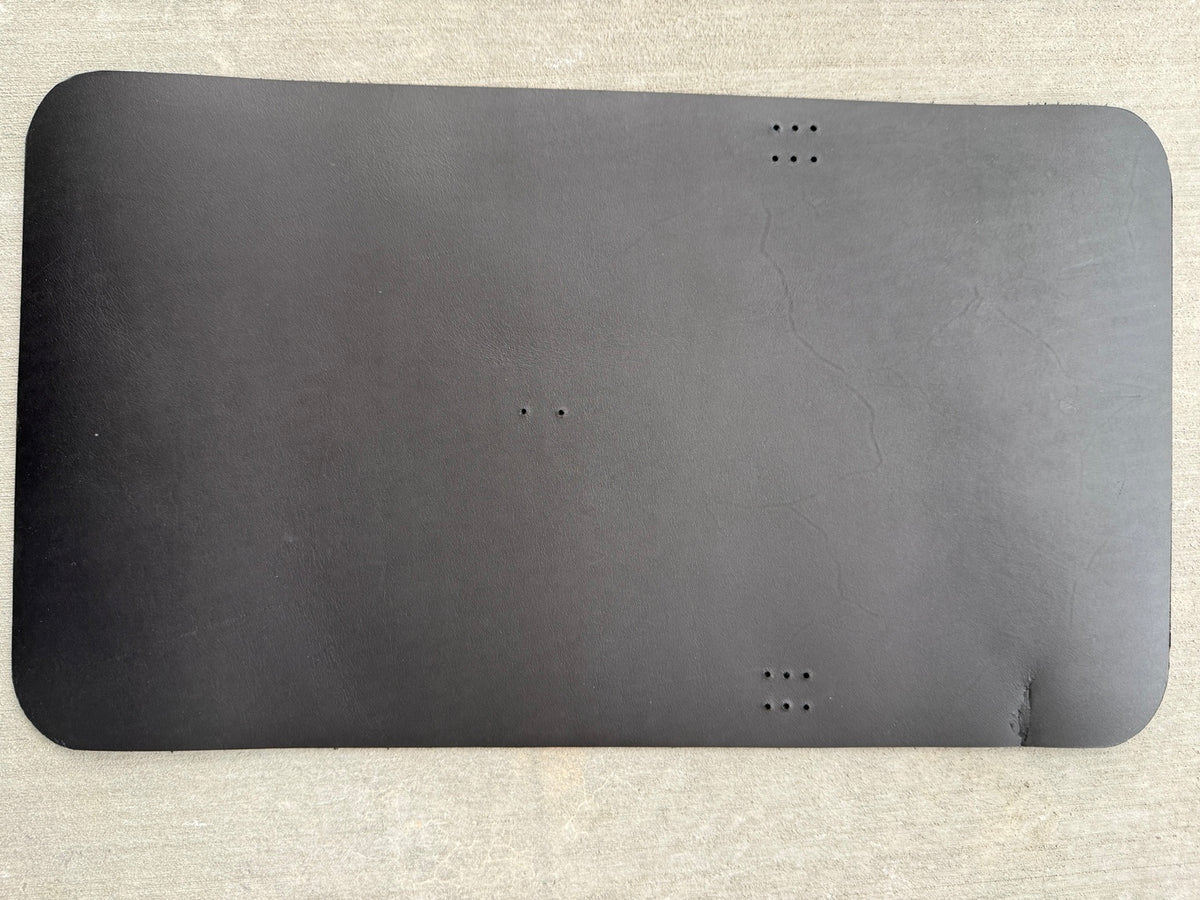A5 black veg-tan Studio Seconds journal with a scuff on the bottom corner