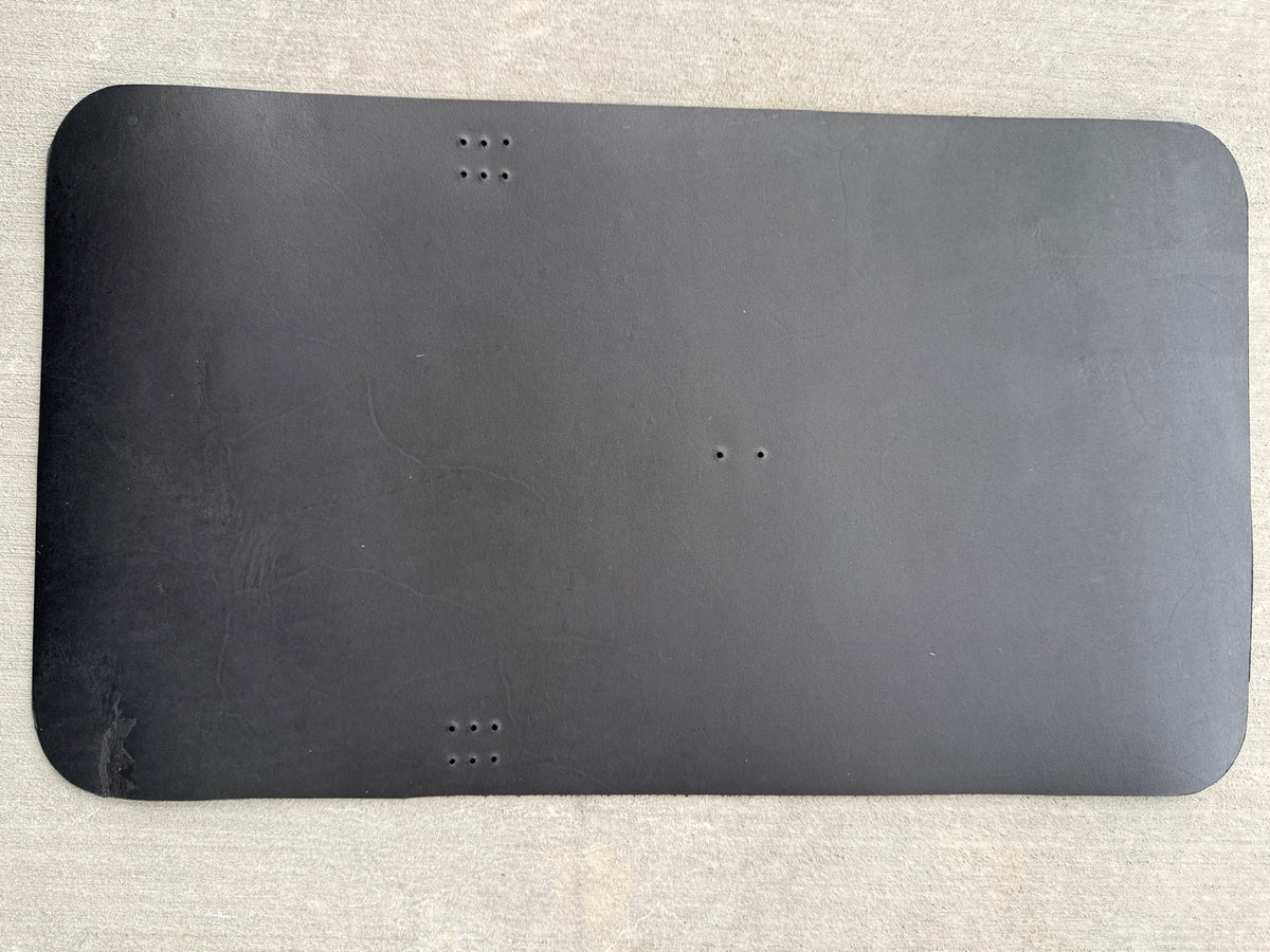 A5 black veg-tan Studio Seconds journal with a scuff on the top-right corner