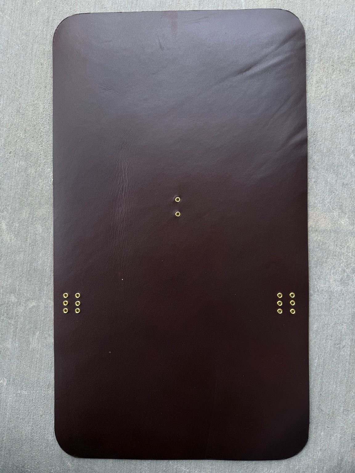 A5 brown Studio Seconds journal with a small crease and gold grommets