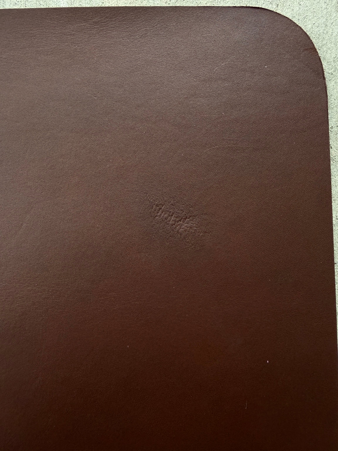 Close-up of imperfection on A5 brown veg tan journal