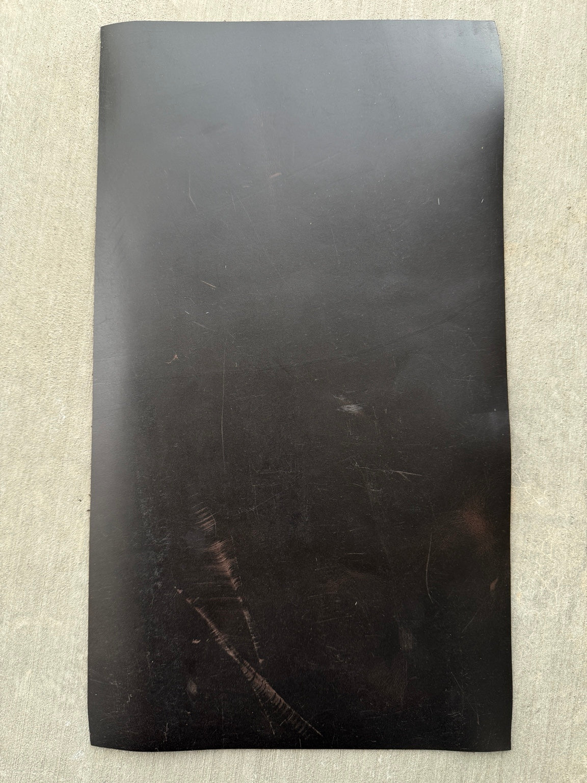 Example 2 of scuffs and scratches on an A5 espresso Studio Seconds journal