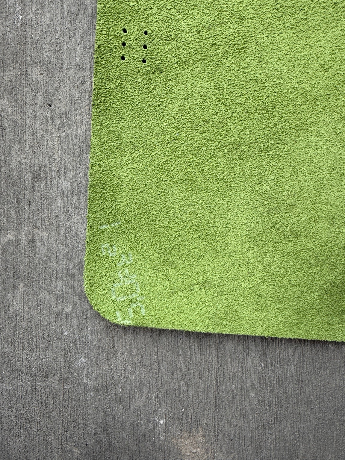 White stamped numbers inside the front cover of A5 green journal